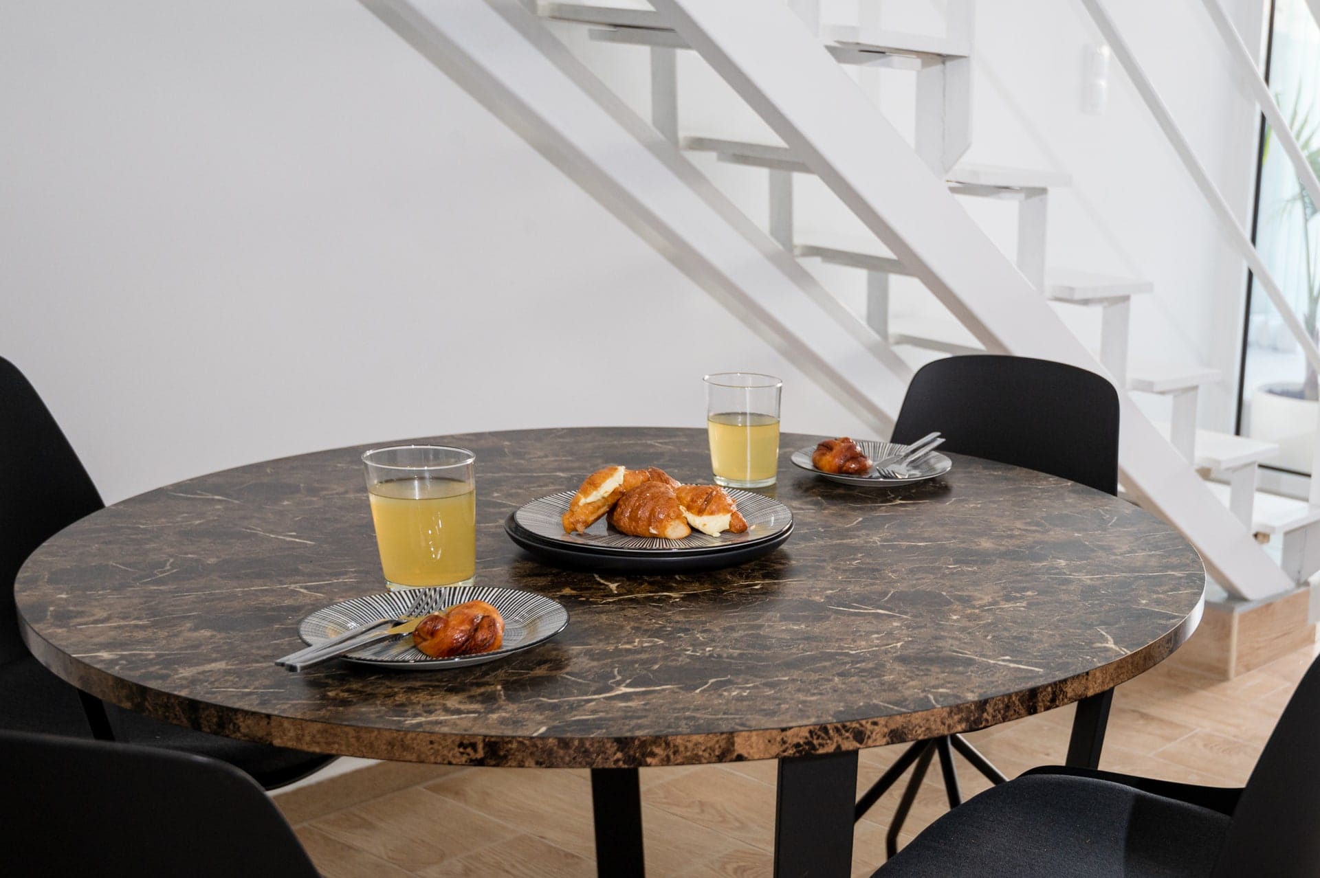 Breakfast laid on the marble dining table