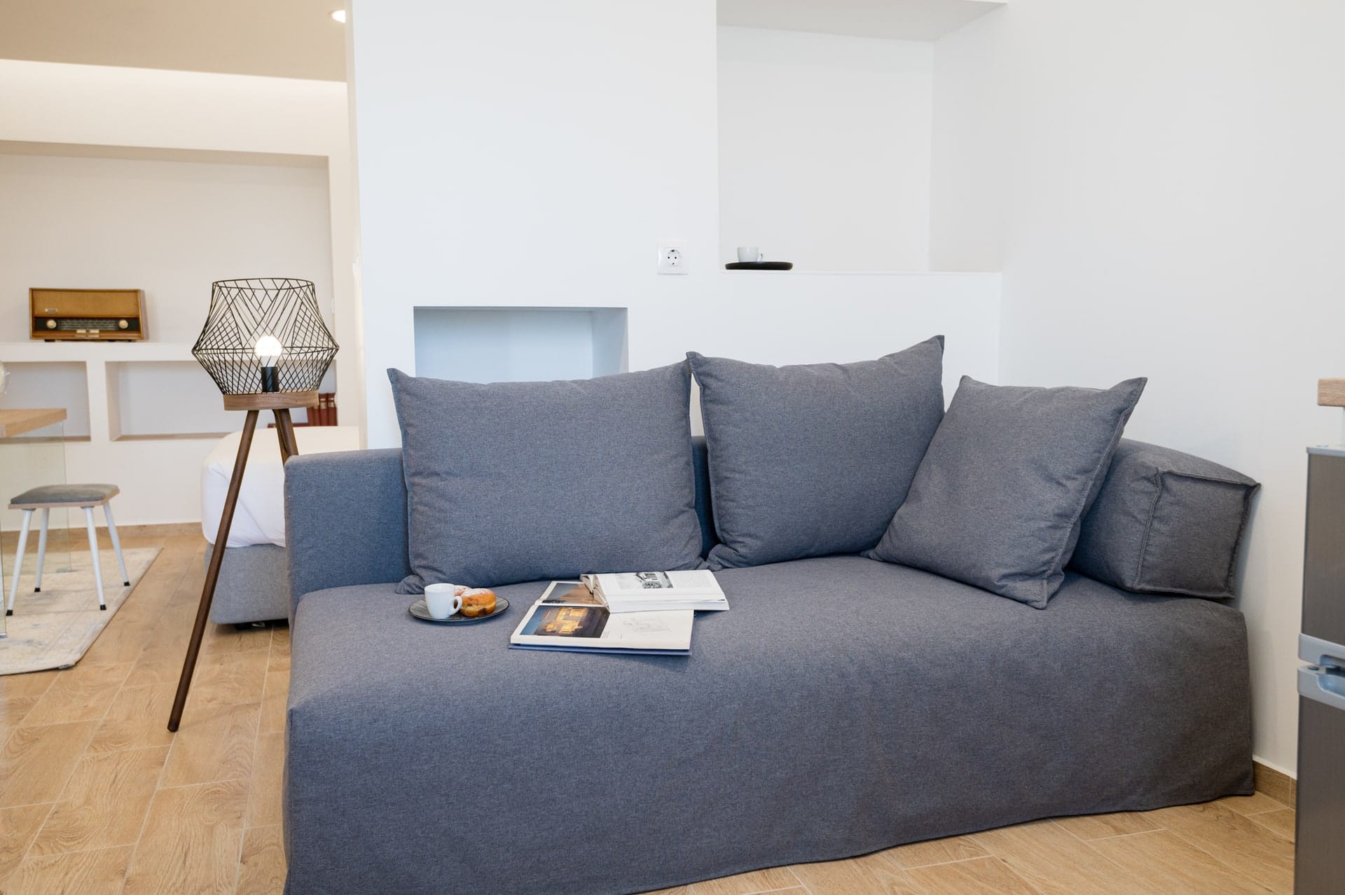 Sofa bed in the living room with scatter cushions
