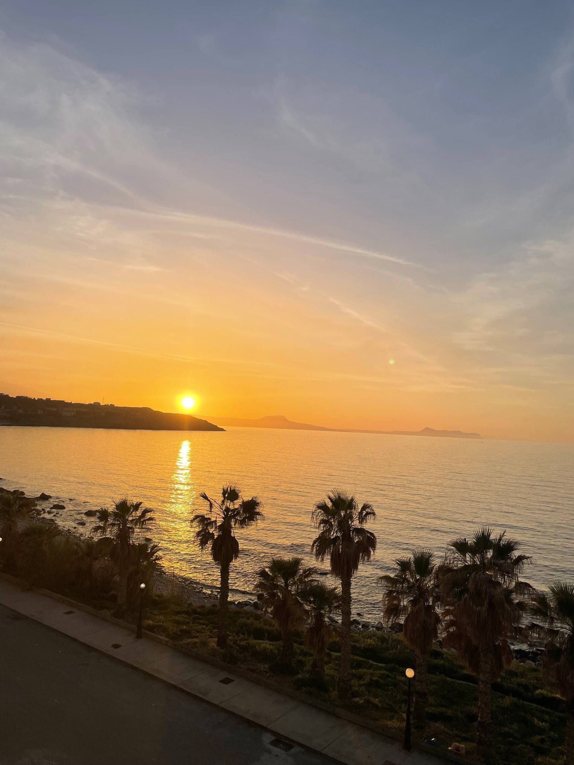 Sunset over the sea seen from the deck