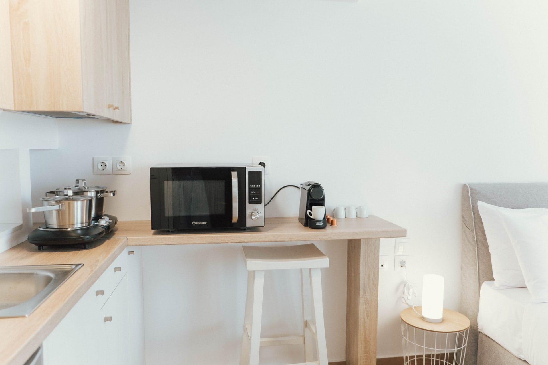 Kitchenette with microwave, coffee machine and worktop
